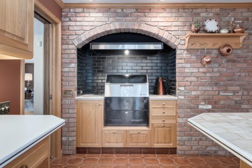 stone feature wall in kitchen around barbeque