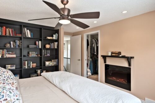 bedroom with built in shelving
